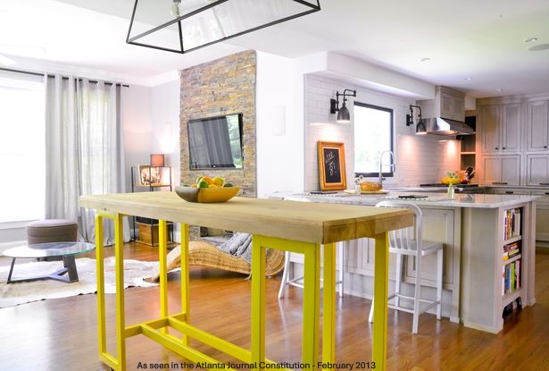 Open concept kitchen and living area with stone fireplace — as seen in the Atlanta Journal Constitution